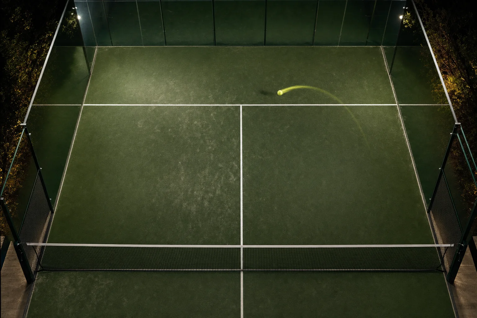 Premium dark padel court with glass wall and service lines